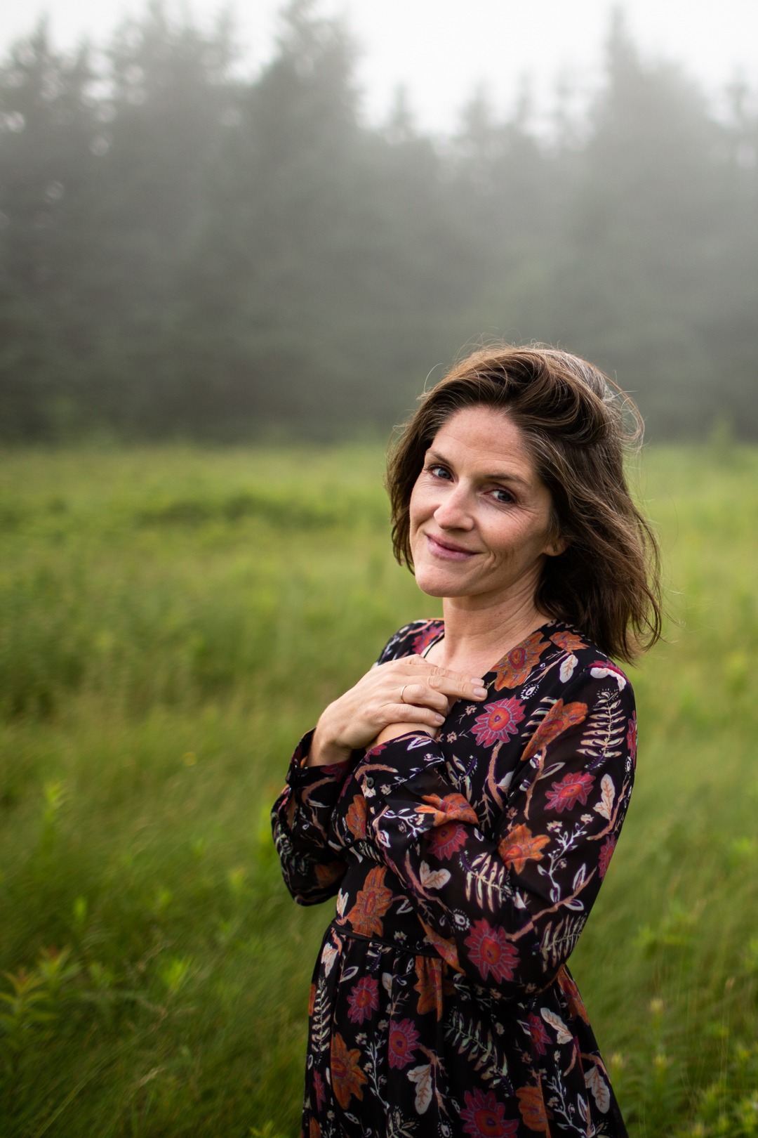 Kate standing in a field.